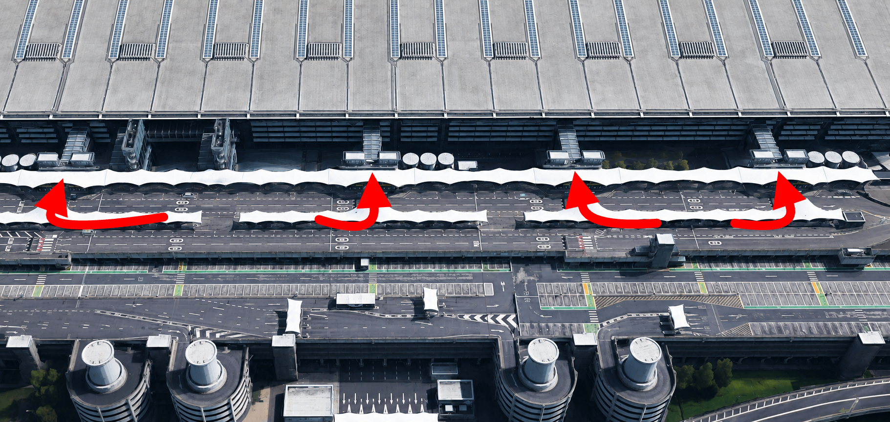 Aerial view with annotated route arrows across the Wellington Road drop-off forecourts at London Heathrow Airport Terminal 5